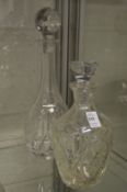 Two cut glass decanters.