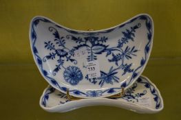 A pair of Meissen blue and white crescent shaped dishes.