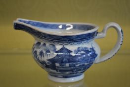 A blue and white jug.