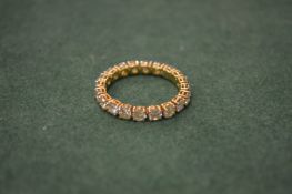 An 18ct gold and diamond eternity ring.