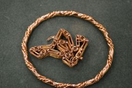 Two gilt metal bracelets.