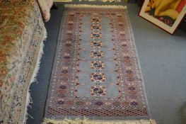 A pale blue ground Bokhara style rug.