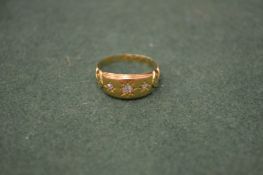 An 18ct gold and diamond set ring.