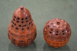 Carved coquilla nut Treen pomander case in the form of a pear and a similar apple shaped pomander