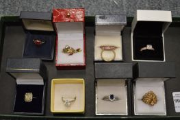 A collection of eight decorative ladies' dress rings.