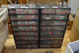 A pair of metal workshop chests.