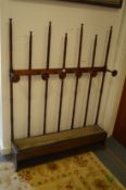 An unusual oak stick / hat stand with turned spindle supports.