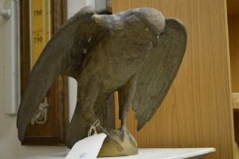 A cast bronze model of an eagle.