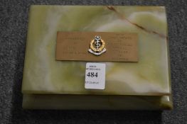 An alabaster cigarette box with Army Medical Services logo.