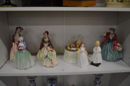 A collection of Royal Doulton figurines.