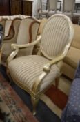 A large French style open armchair with silvered frame.