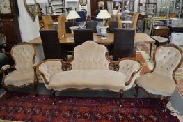 A very good Victorian carved walnut three-piece salon suite comprising a settee, armchair and side
