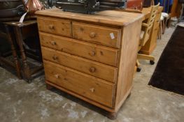 A pine chest of drawers.