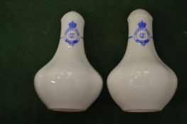A pair of Queen's Club salt shakers.
