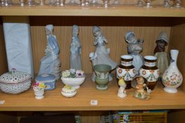 A shelf of decorative china.
