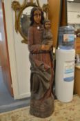 A large carved wood Madonna and Child, 5ft 3ins tall.