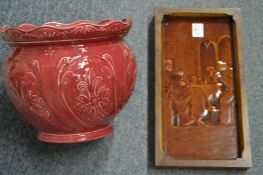 A treacle glazed pottery plaque and a jardiniere.