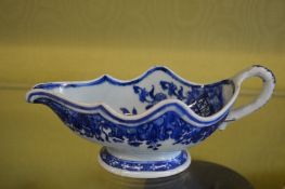 A Chinese blue and white sauceboat.
