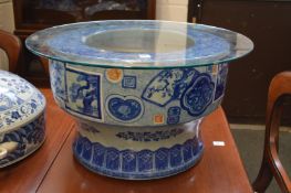A large Japanese Arita blue and white porcelain Hibachi (jardiniere) with later glass top.