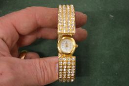 A ladies' decorative bangle wristwatch.