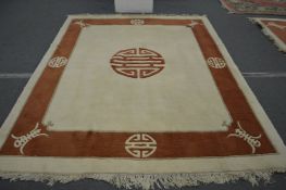 A modern Chinese carpet, beige ground with a decorative border 9ft 8ins x 7ft 9ins.