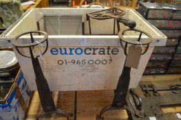 A pair of wrought iron fire dogs, and old trivet, box iron etc.