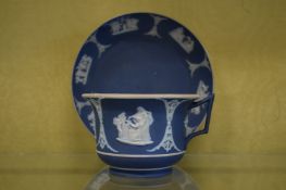 A Wedgwood Jasper ware cup and saucer.