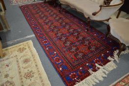 A good Persian Bokhara style hall carpet.