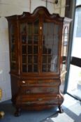 A good 18th/19th century Dutch walnut cabinet on chest of bombe form.