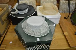 Three ladies' hats, boxed.