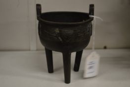 A Chinese Ming style bronze tripod censer.