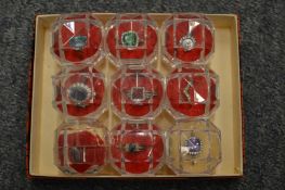 Nine decorative dress rings.