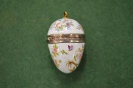 A small enamel egg shaped pomander.