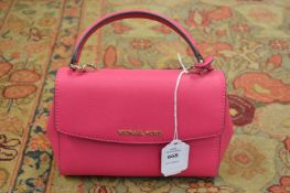 A Michael Kors cerise leather small handbag.