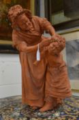 A large terracotta model of the Pear's Soap group 