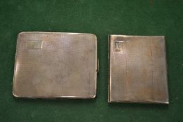 Two silver cigarette cases.