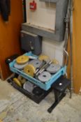 A weight lifting bench and numerous weights, dumbbells etc.