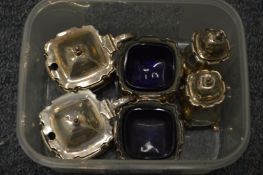 A six-piece silver cruet set.