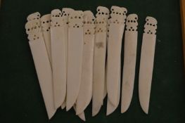 A collection of carved ivory letter openers.