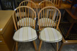 A set of four spindle back kitchen chairs.