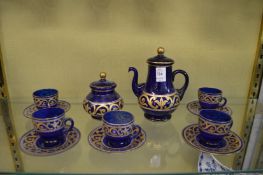 A blue glass and gilt decorated part tea service.