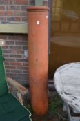 A large terracotta chimney pot 4ft 10ins high.