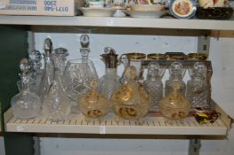A shelf of glassware to include a tantalus.