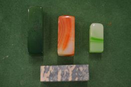 A group of four carved hardstone seals.