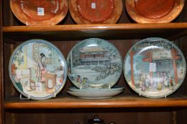 Five Chinese plates decorated with figures and landscapes.