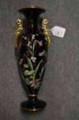 An enamel decorated twin handled vase.