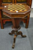 A Victorian walnut octagonal shaped games / work table.