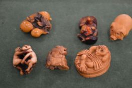 A collection of carved boxwood netsukes.