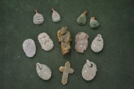 A collection of Chinese carved jade amulets and pendants.