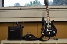 An Alba electric guitar with a Watson amplifier and accessories.